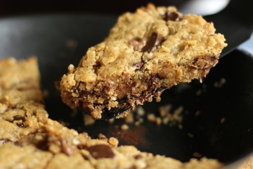 A one bowl method for a soft, gooey, peanut butter chocolate chip pan cookie.