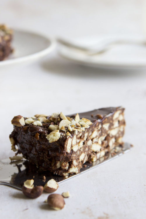 A medley of biscuits, hazelnuts, Nutella and a whole lot of chocolate form a decadent chocolate fridge cake. Bonus: No oven required.