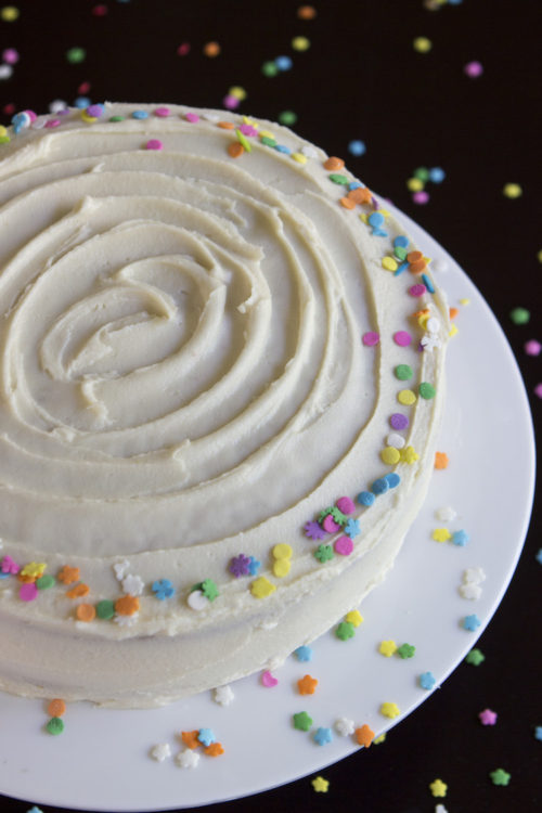 A soft, fluffy vanilla funfetti cake studded with rainbow sprinkles and topped with a rich vanilla buttercream.