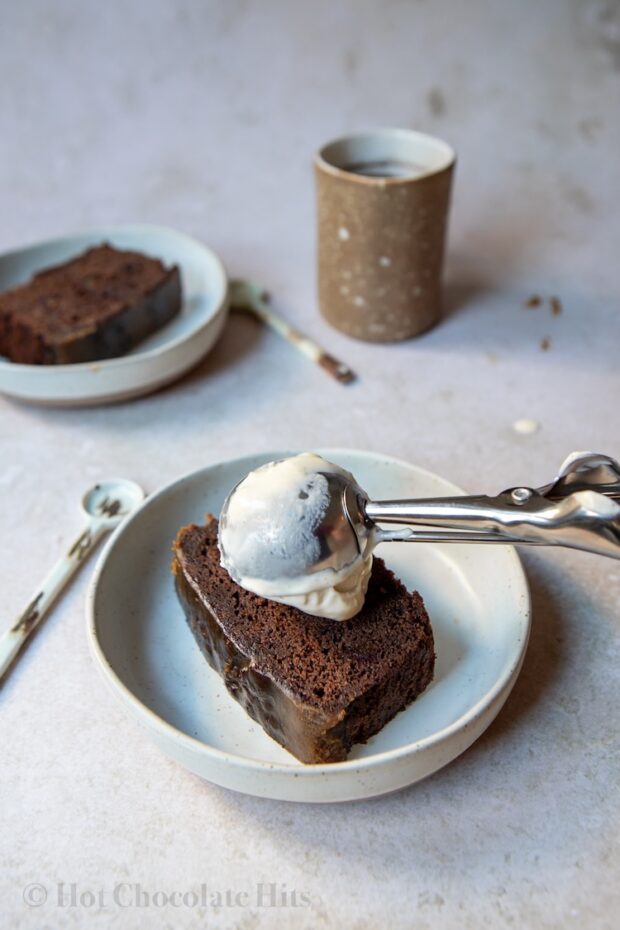 Picture of putting ice cream on piece of sticky toffee pudding